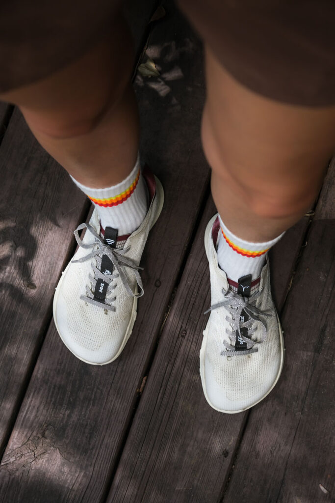 Lono Verve barefoot trail runners being worn on a deck